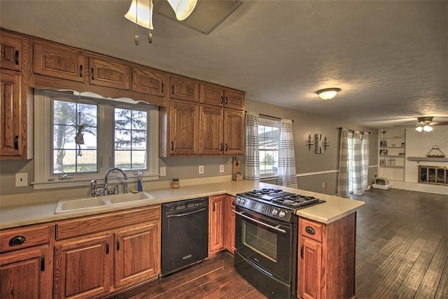 8070 Cerro Gordo Blacktop, Oakley, IL 62501 - kitchen featuring a sink, black appliances, a peninsula, open floor plan, and ceiling fan