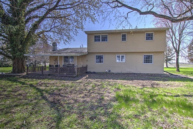 8070 Cerro Gordo Blacktop, Oakley, IL 62501 - back of house with a wooden deck