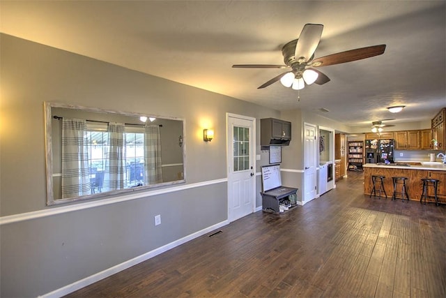 8070 Cerro Gordo Blacktop, Oakley, IL 62501 - living area with ceiling fan, baseboards, dark wood-style flooring, and visible vents
