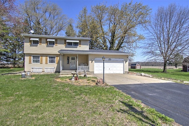8070 Cerro Gordo Blacktop, Oakley, IL 62501 - traditional-style home featuring concrete driveway, a front lawn, a garage, and covered porch