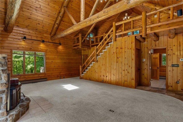 5446 N 1700th St, Dieterich, IL 62424 - unfurnished living room featuring a wooden ceiling with exposed beams, high vaulted ceiling, plenty of natural light, carpet floors, and a baseboard heating unit