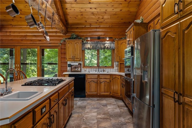 5446 N 1700th St, Dieterich, IL 62424 - kitchen with stainless steel fridge, dishwasher, gas stovetop, wood ceiling, and brown cabinetry