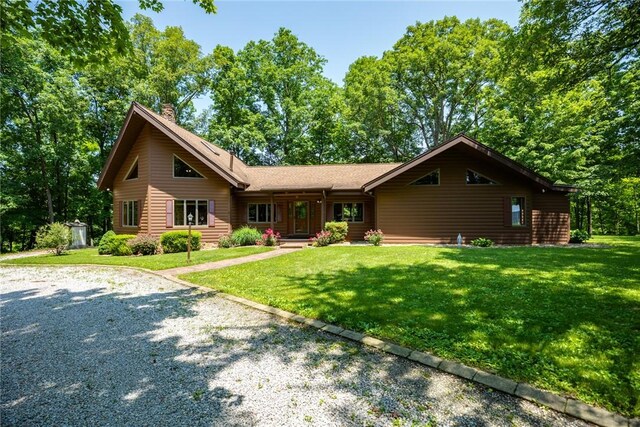 5446 N 1700th St, Dieterich, IL 62424 - view of front of property with a chimney, a front yard, a porch, and an outbuilding