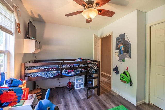 130 S Illinois St, Warrensburg, IL 62573 - bedroom with wood finished floors and a ceiling fan