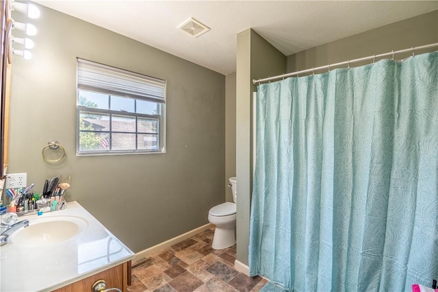 130 S Illinois St, Warrensburg, IL 62573 - full bathroom featuring stone finish flooring and vanity