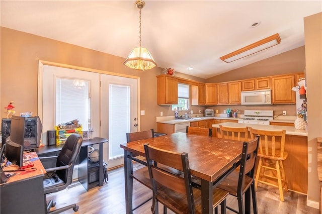 130 S Illinois St, Warrensburg, IL 62573 - dining area with lofted ceiling, light wood finished floors, and a desk