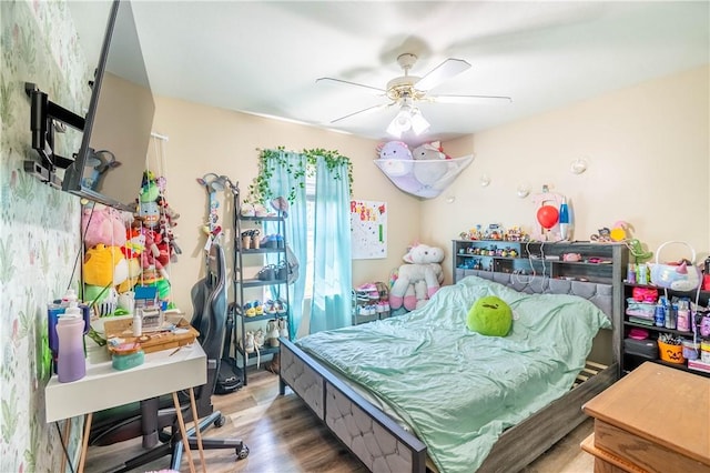 130 S Illinois St, Warrensburg, IL 62573 - bedroom with wood finished floors and ceiling fan