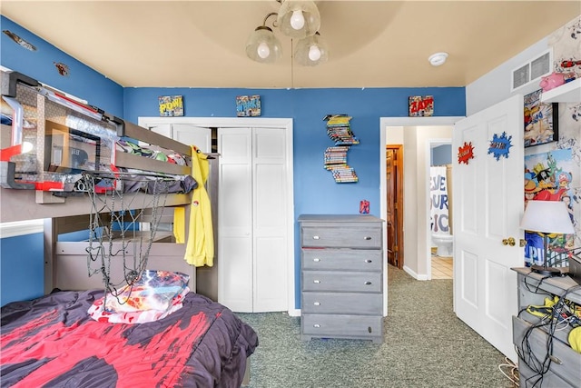 carpeted bedroom with a ceiling fan, a closet, visible vents, and baseboards