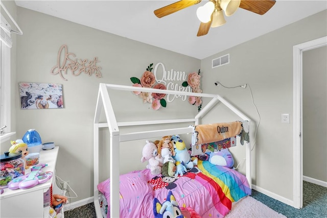 bedroom with a ceiling fan, baseboards, visible vents, and carpet flooring