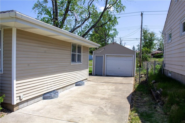 view of home's exterior featuring an outdoor structure, a garage, fence, and crawl space