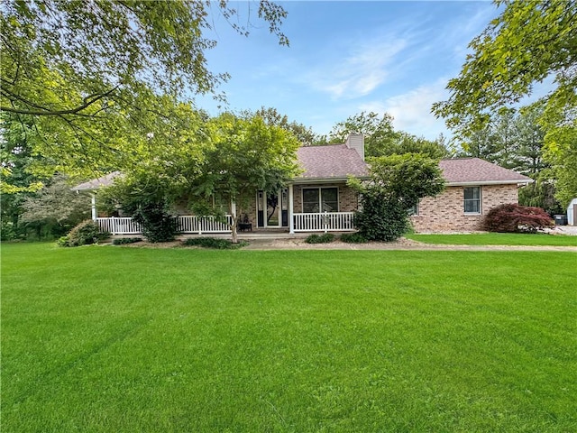 10 Rose Ln, Marshall, IL 62441 - view of front of home with a front lawn, a chimney, a porch, and brick siding