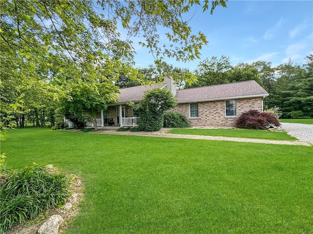 10 Rose Ln, Marshall, IL 62441 - view of front facade featuring a front yard, a chimney, and covered porch