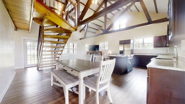 67 Shores, Sullivan, IL 61951 - dining space with stairs, beam ceiling, high vaulted ceiling, healthy amount of natural light, and dark wood-style floors