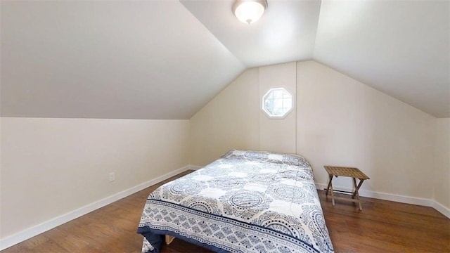 67 Shores, Sullivan, IL 61951 - bedroom with wood finished floors, vaulted ceiling, and baseboards