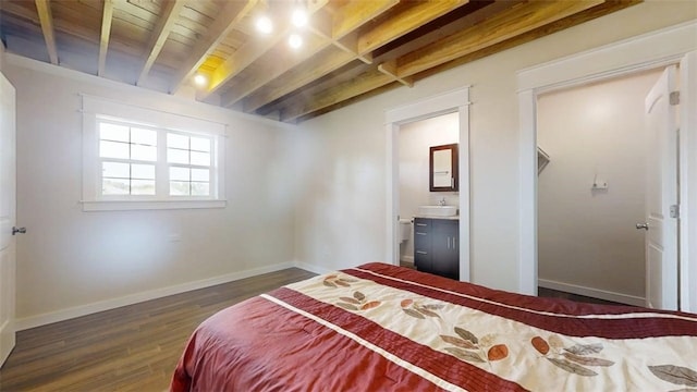67 Shores, Sullivan, IL 61951 - bedroom featuring wood finished floors, beamed ceiling, baseboards, and connected bathroom