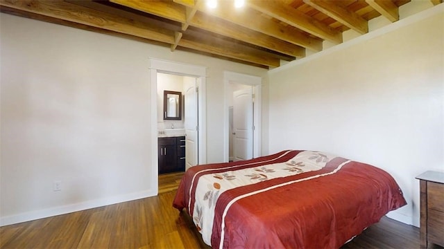 67 Shores, Sullivan, IL 61951 - bedroom with beamed ceiling, dark wood-type flooring, baseboards, and ensuite bath