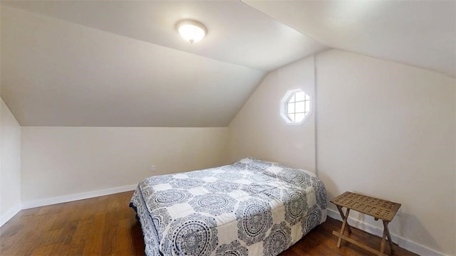 67 Shores, Sullivan, IL 61951 - bedroom featuring wood finished floors, lofted ceiling, and baseboards