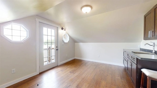 67 Shores, Sullivan, IL 61951 - bonus room with a sink, light wood-type flooring, vaulted ceiling, and baseboards