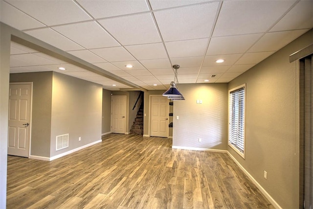 8898 Country Side Dr, Dalton City, IL 61925 - unfurnished room featuring stairs, wood finished floors, a paneled ceiling, and recessed lighting