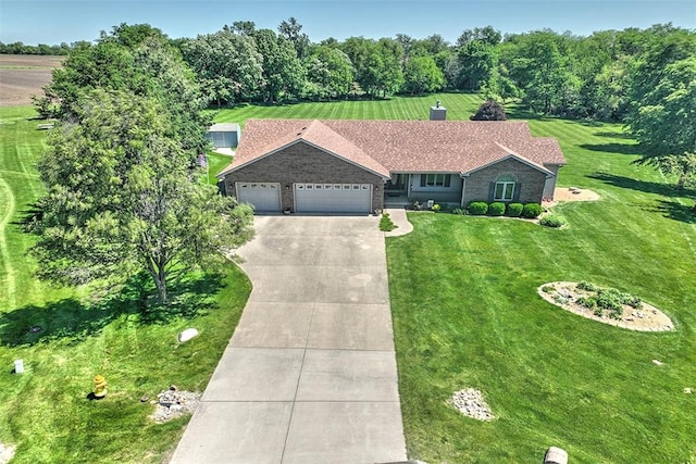 8898 Country Side Dr, Dalton City, IL 61925 - ranch-style house with a garage, concrete driveway, and a front lawn