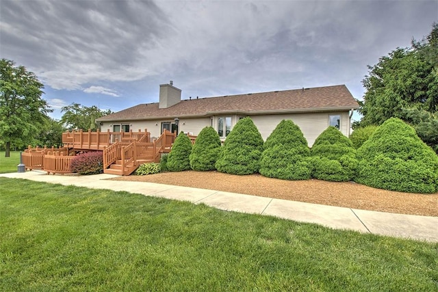 8898 Country Side Dr, Dalton City, IL 61925 - rear view of house featuring a deck, a chimney, and a lawn
