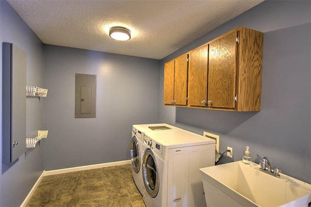 8898 Country Side Dr, Dalton City, IL 61925 - laundry area with electric panel, cabinet space, washing machine and dryer, and a textured ceiling