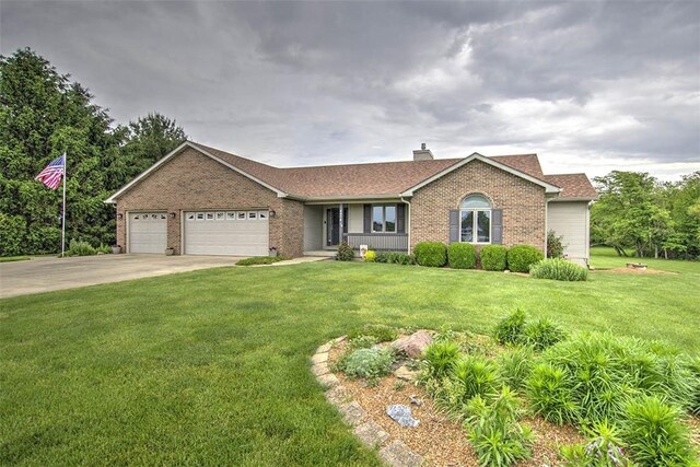8898 Country Side Dr, Dalton City, IL 61925 - ranch-style house featuring brick siding, an attached garage, driveway, and a front lawn