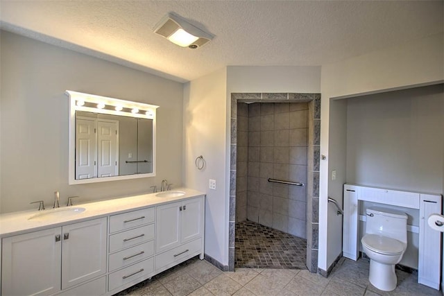 8898 Country Side Dr, Dalton City, IL 61925 - bathroom with walk in shower, double vanity, tile patterned floors, and a textured ceiling