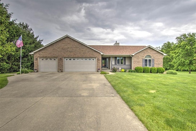 8898 Country Side Dr, Dalton City, IL 61925 - ranch-style home with brick siding, a front lawn, concrete driveway, an attached garage, and a chimney