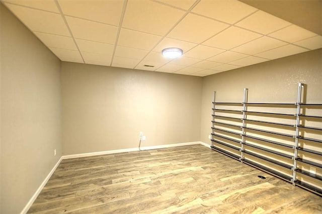 8898 Country Side Dr, Dalton City, IL 61925 - empty room with wood finished floors and a paneled ceiling
