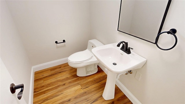 2550 Ivy Ln, Decatur, IL 62521 - bathroom with toilet and wood finished floors