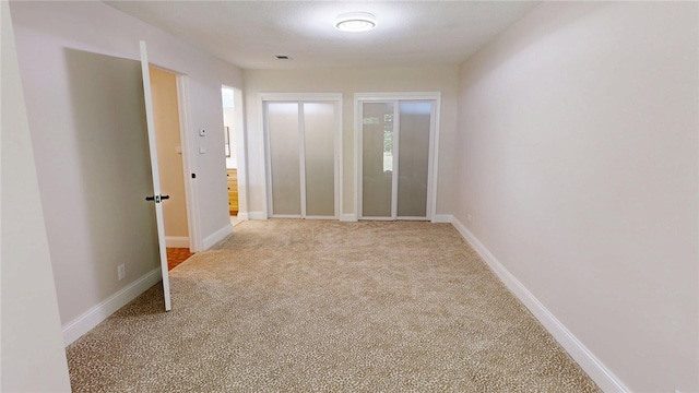 2550 Ivy Ln, Decatur, IL 62521 - unfurnished room featuring light colored carpet and baseboards