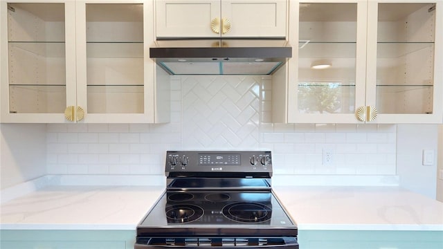 2550 Ivy Ln, Decatur, IL 62521 - kitchen with electric range, extractor fan, backsplash, and glass insert cabinets
