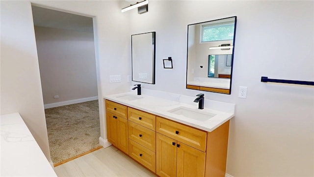 2550 Ivy Ln, Decatur, IL 62521 - bathroom with double vanity and baseboards