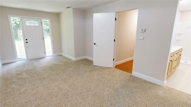 2550 Ivy Ln, Decatur, IL 62521 - entryway with light carpet and baseboards
