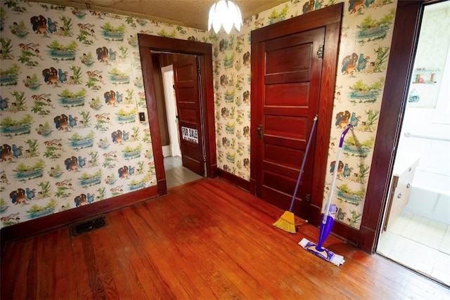 foyer entrance featuring wood-type flooring