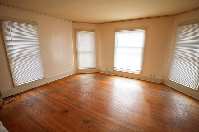 spare room featuring hardwood / wood-style floors