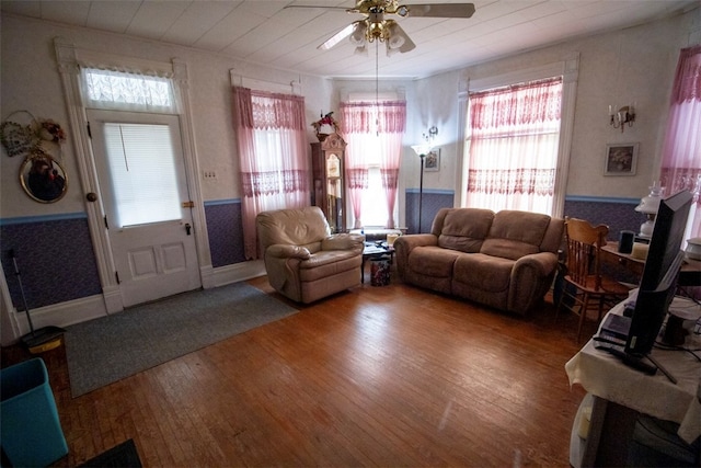 living room with ceiling fan, wood-type flooring, and wooden ceiling