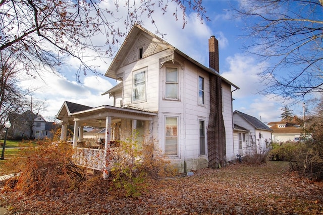 view of home's exterior with covered porch