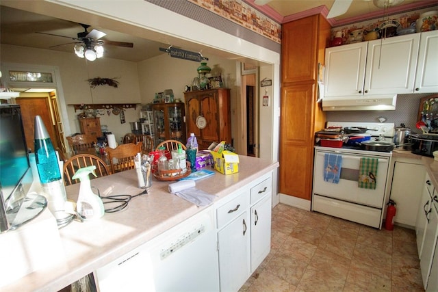 kitchen featuring white cabinets, white stove, and ceiling fan