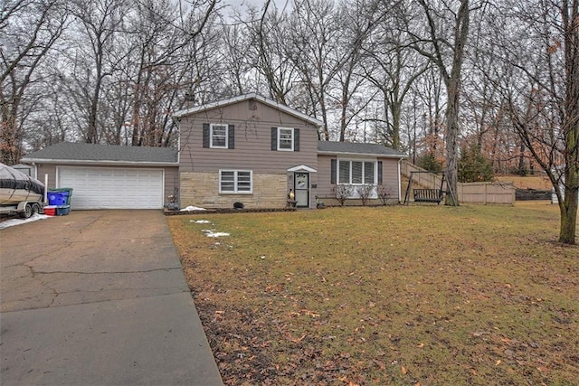 view of front of property with a garage and a front yard