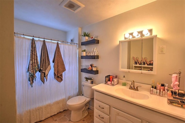 full bathroom with vanity, shower / tub combo, and toilet