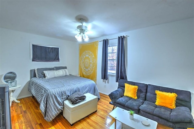 bedroom with hardwood / wood-style floors