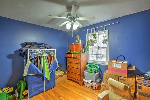 recreation room featuring hardwood / wood-style flooring and ceiling fan