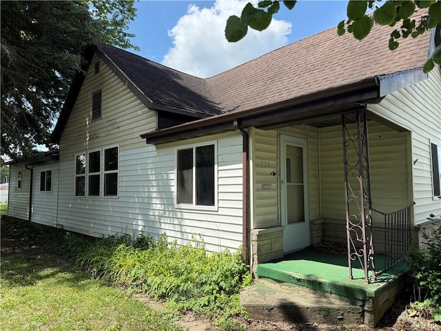 116 Warrington Ave, Danville, IL 61832 - view of side of home with roof with shingles and a porch