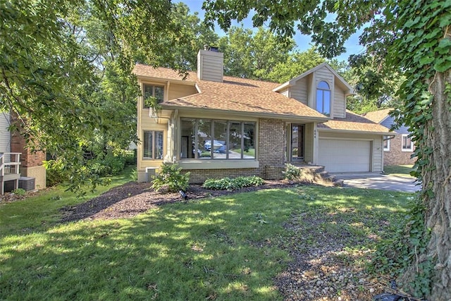 664 N Antler Dr, Mt Zion, IL 62549 - view of front of house with a front lawn, a chimney, concrete driveway, and brick siding