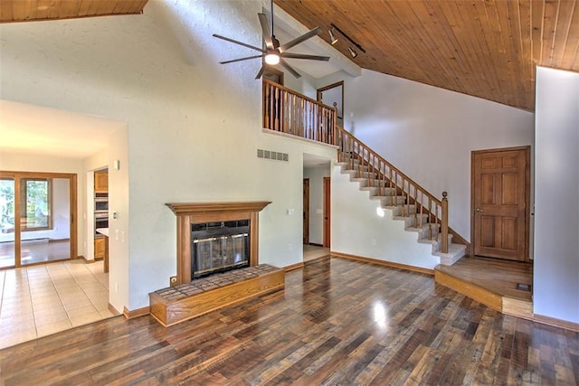 664 N Antler Dr, Mt Zion, IL 62549 - unfurnished living room with a ceiling fan, wood finished floors, high vaulted ceiling, wood ceiling, and a glass covered fireplace
