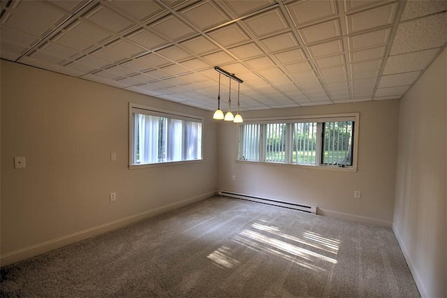 664 N Antler Dr, Mt Zion, IL 62549 - empty room with a baseboard heating unit and carpet floors