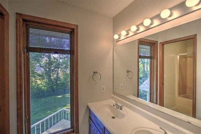 664 N Antler Dr, Mt Zion, IL 62549 - bathroom featuring double vanity and a textured ceiling