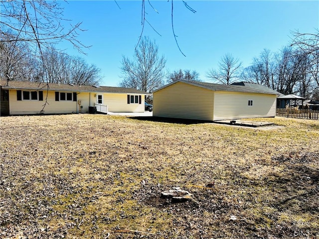 rear view of house with fence